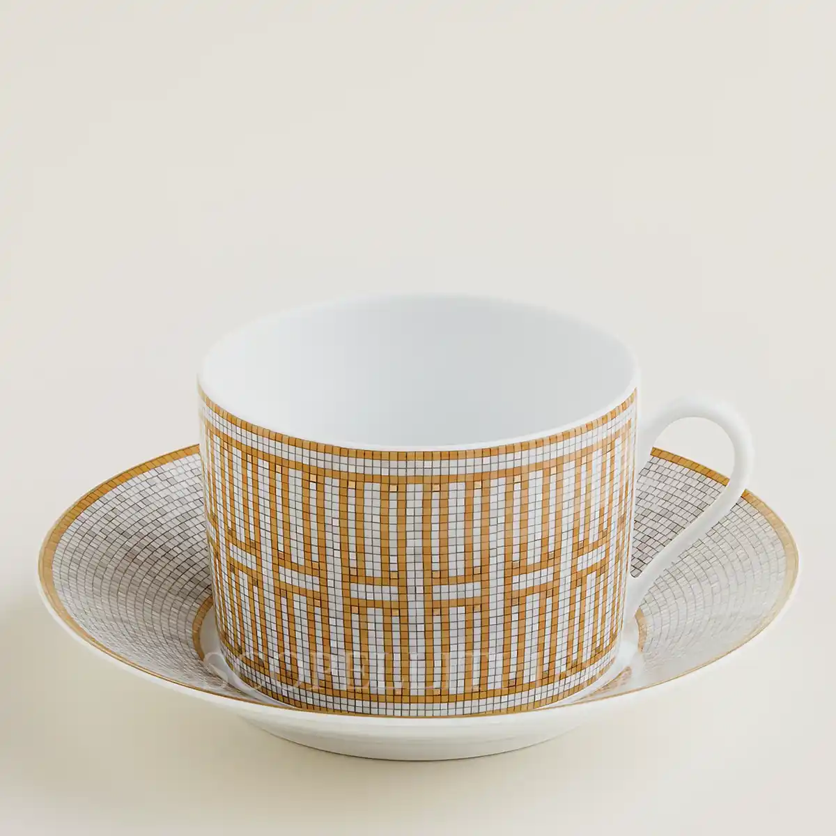 hermès mosaique au 24 breakfast cup and saucer in limoges porcelain with gold mosaic decoration