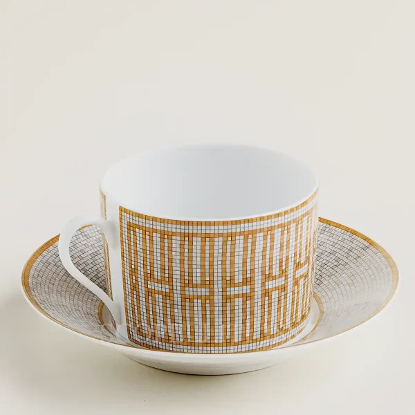 hermès mosaique au 24 breakfast cup and saucer with gold geometric mosaic pattern