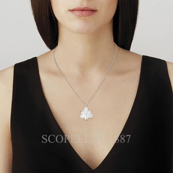 woman wearing lalique fleur de neige small pendant