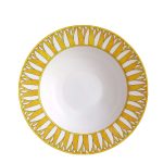 soleil d’hermès limoges porcelain pasta plate with vibrant yellow accents