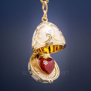 faberge surprise locket with heart yellow gold