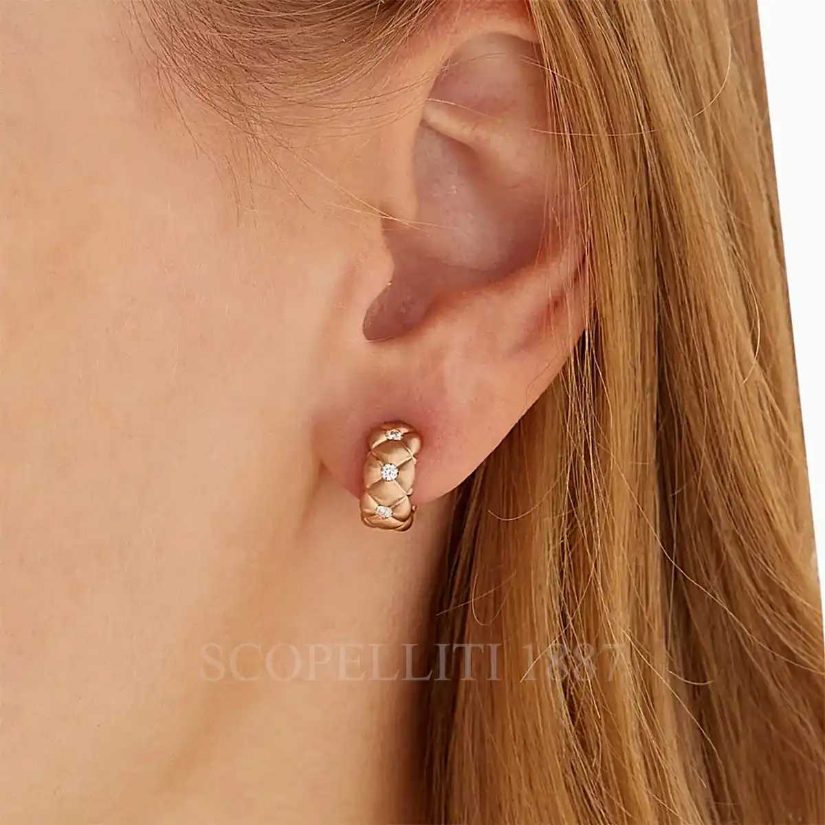 woman wearing fabergé crown diamond hoop earrings