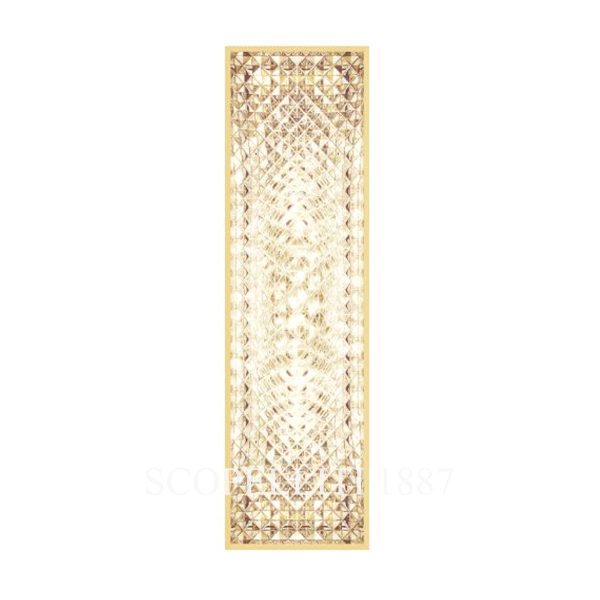 saint louis vibration sconce gold light on