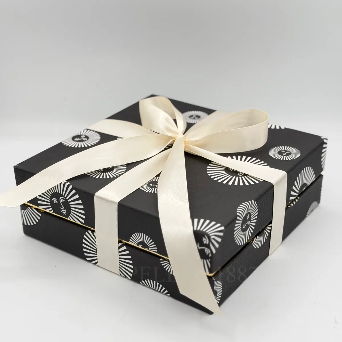 fornasetti gift box with ribbon