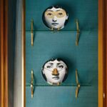 fornasetti wall plates tema e variazioni with gold detailing