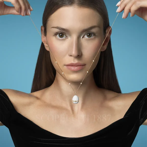 woman with fabergé white enamel egg pendant no 1