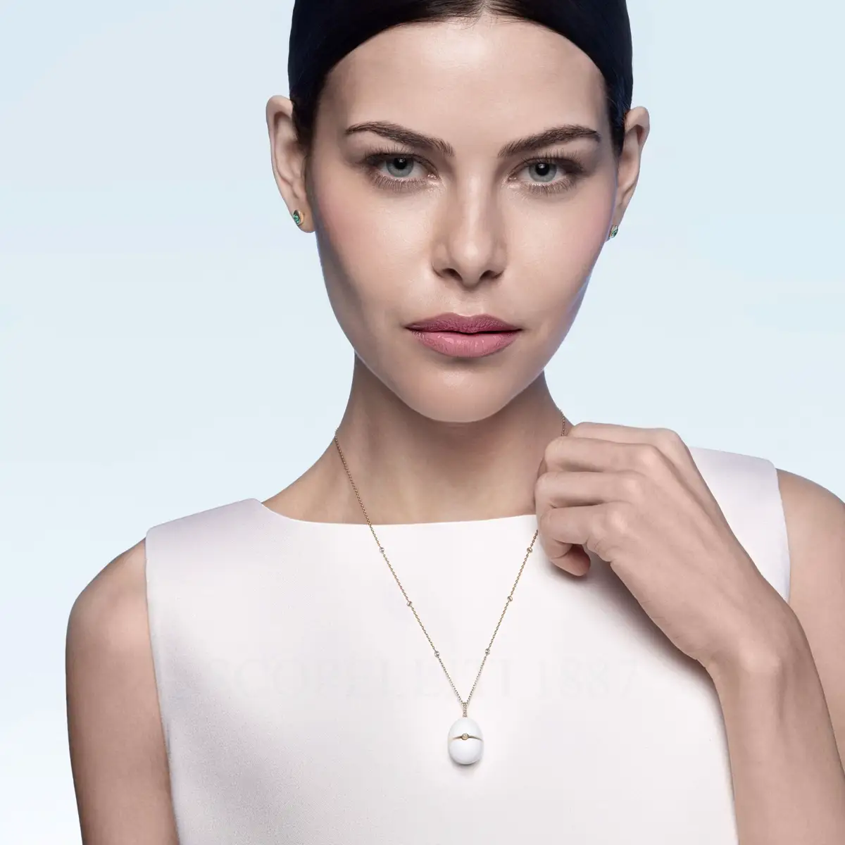 woman wearing fabergé white enamel egg pendant no 1