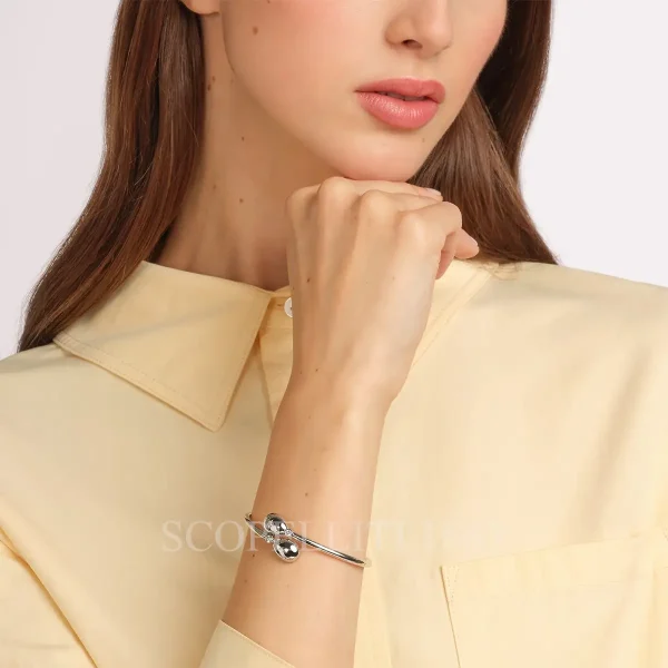 woman wearing fabergé essence white gold i love you crossover bracelet