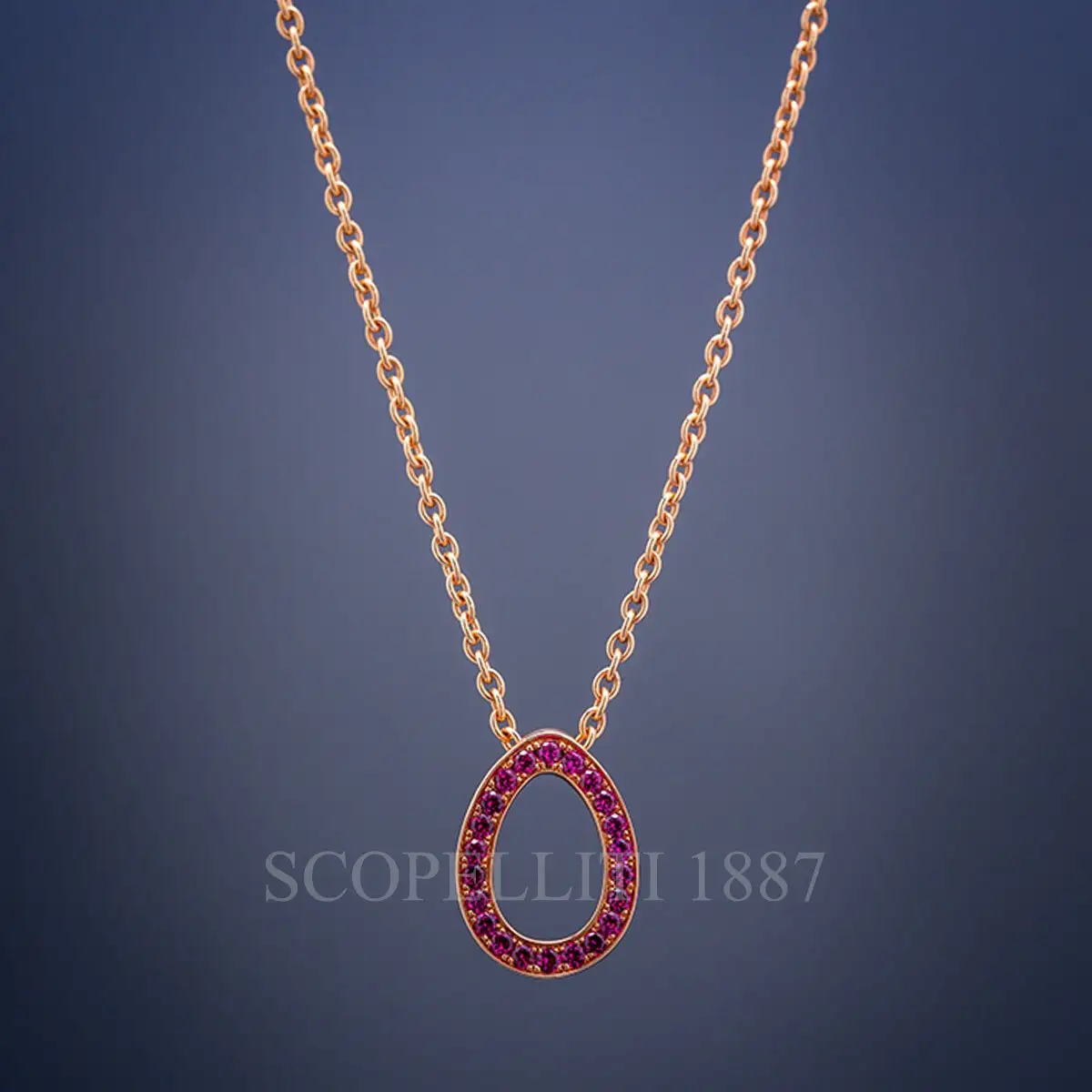 fabergé sasha rose gold ruby egg pendant black background