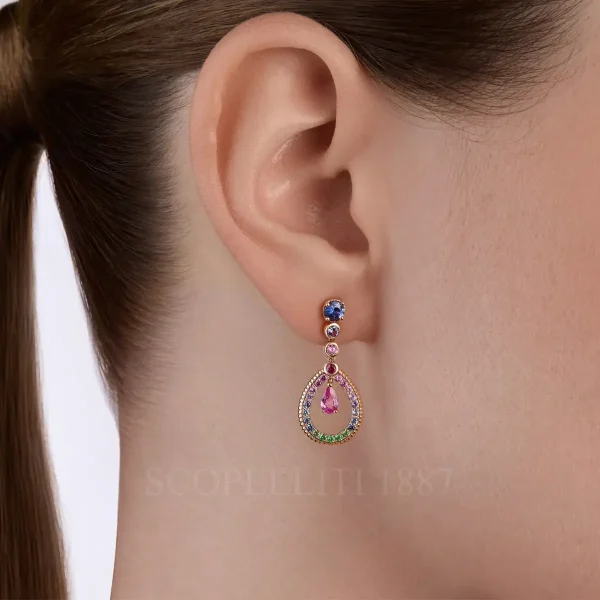 woman wearing fabergé teardrop mixed gemstone earring