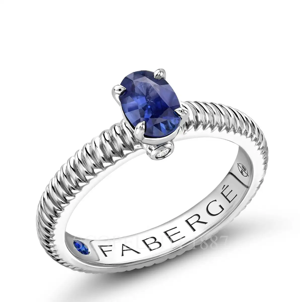 fabergé white gold solitaire ring with large blue sapphire