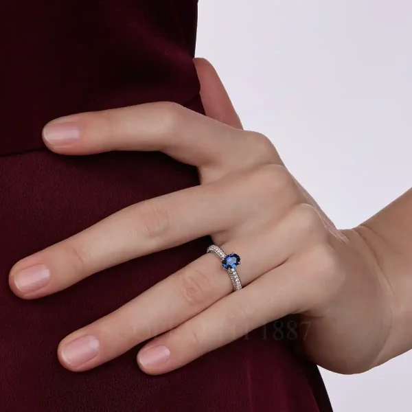 fabergé diamond pavé ring with large blue sapphire
