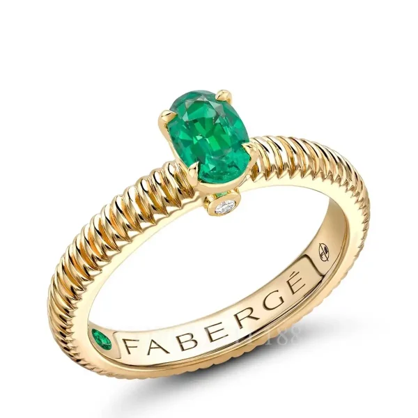 fabergé yellow gold solitaire ring with emerald