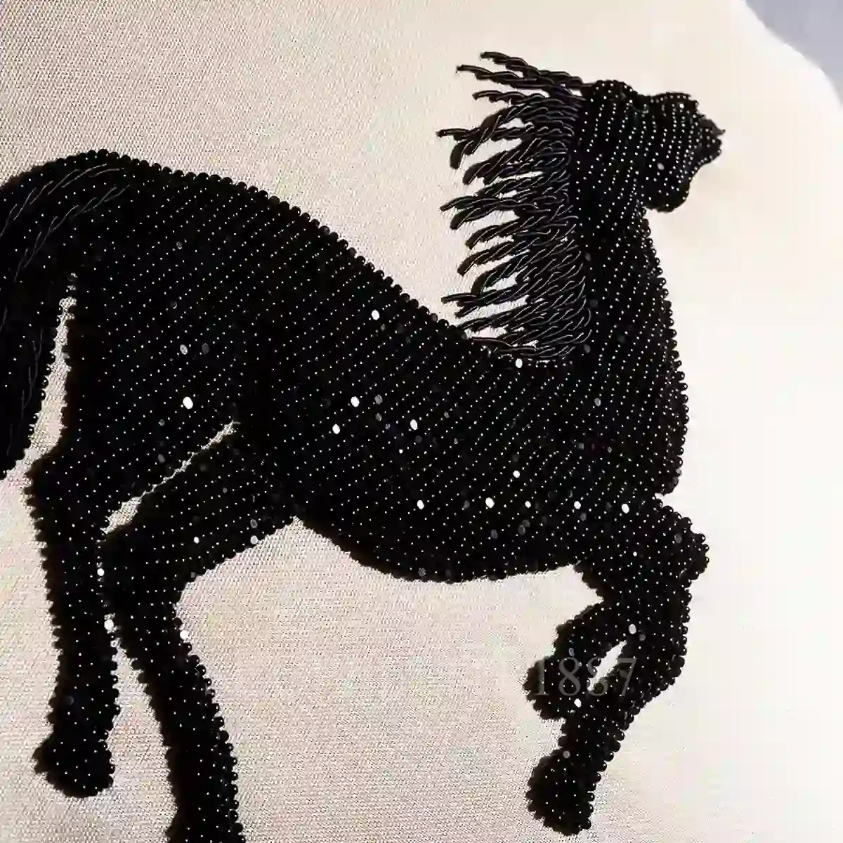 lalique cheval bondissant beaded cushion detail