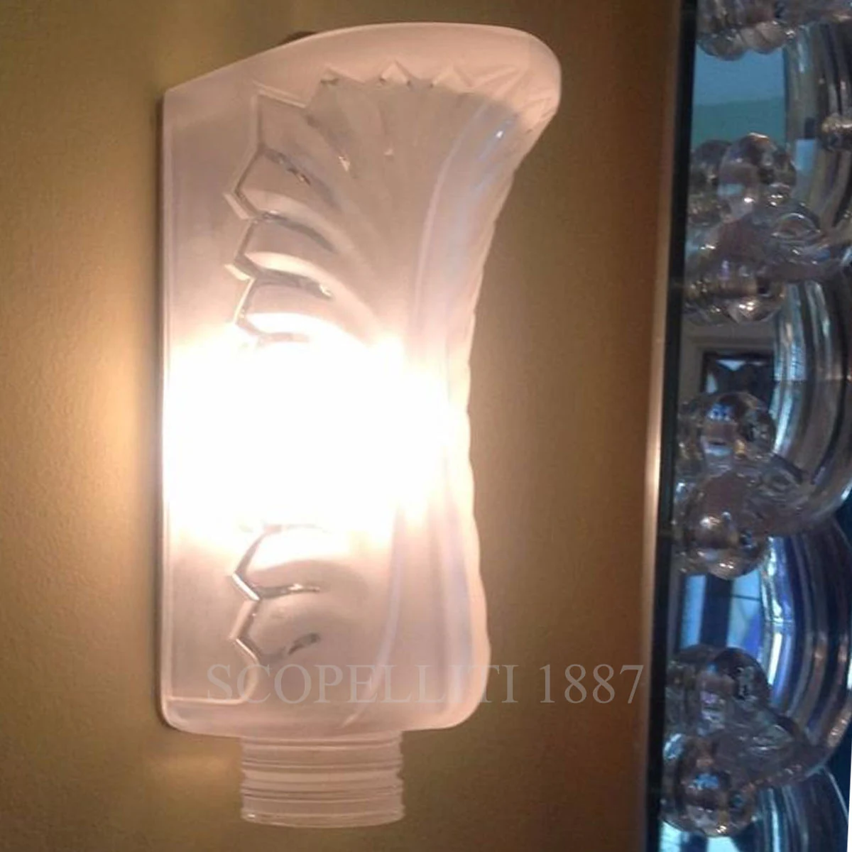 lalique palme wall sconce light on