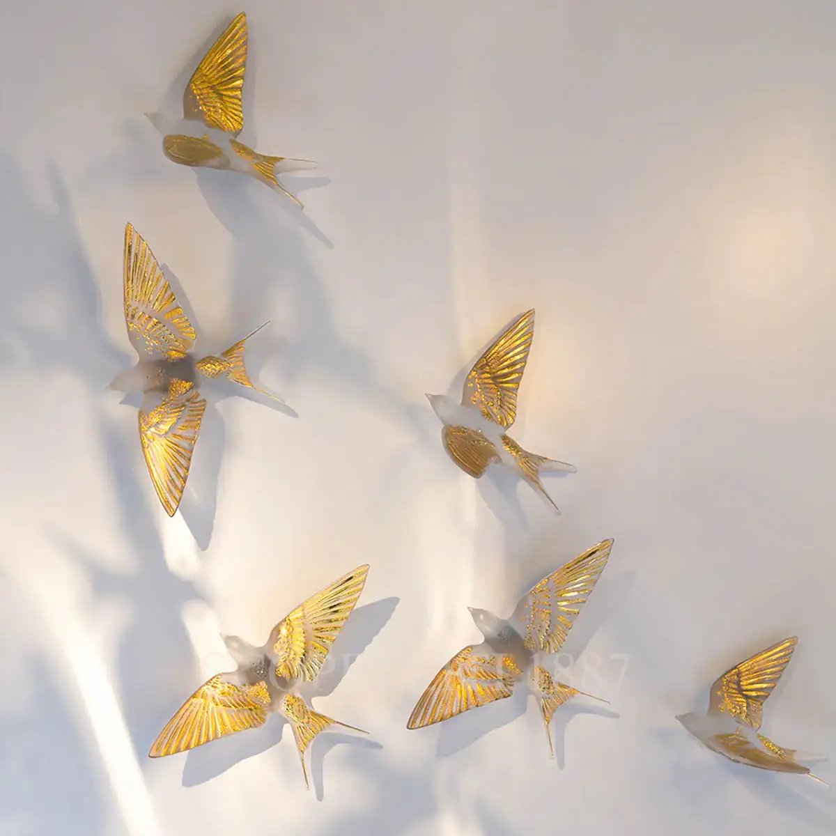 lalique swallows wall sculpture in clear crystal with gold details