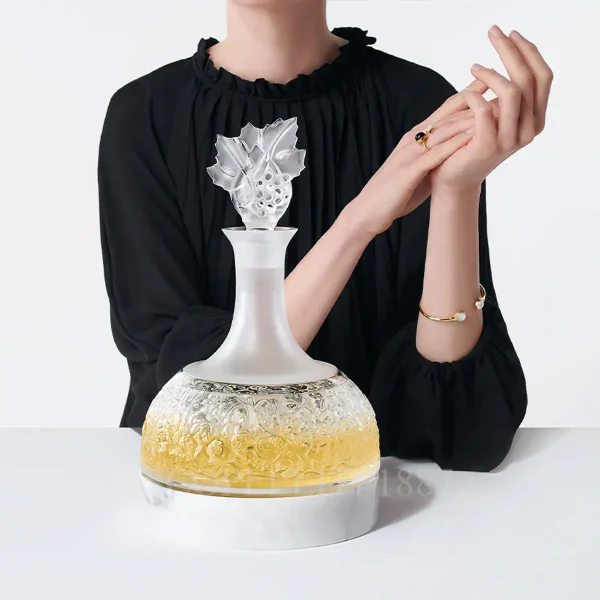 woman posing with lalique versailles decanter in clear crystal