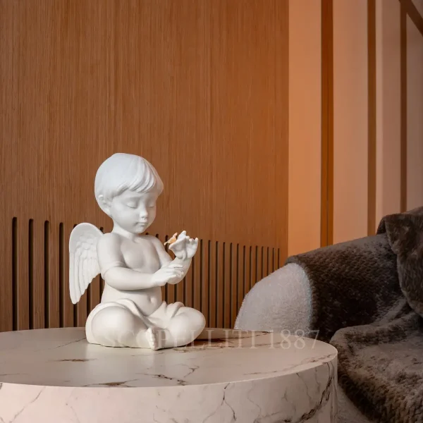 lladró angel with flower porcelain figurine